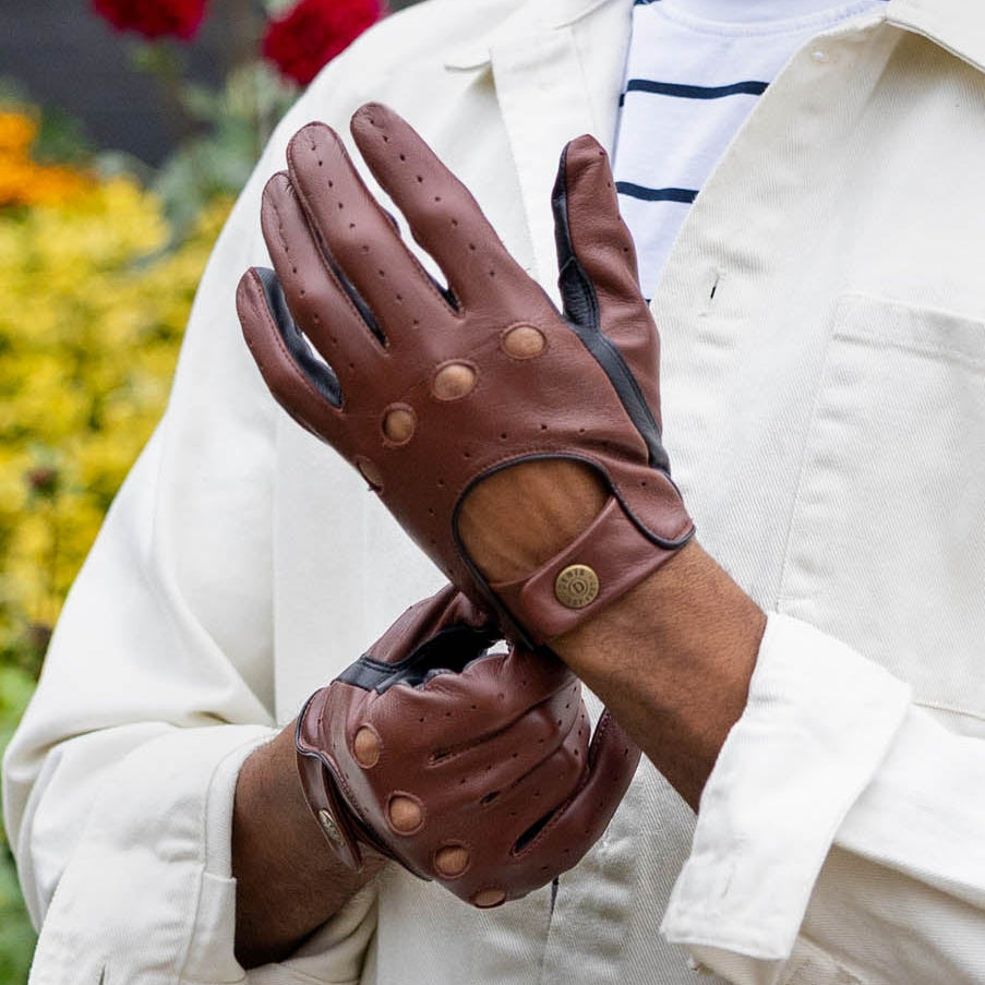 Man wearing leather driving gloves in english tan/black